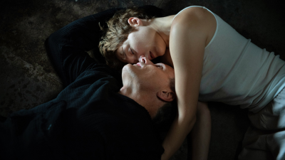 Saul and Caprice lie together